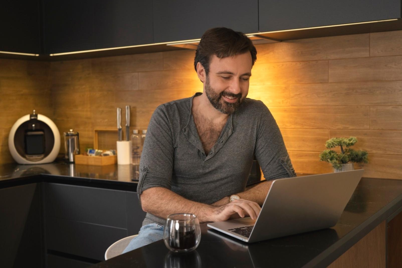 Business owner reviewing cash flow dashboard on laptop